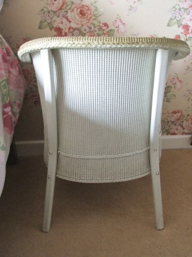 Vintage wicker chair with floral seat