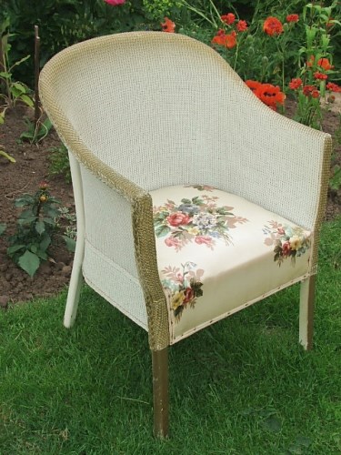 White wickr chair with floral seat